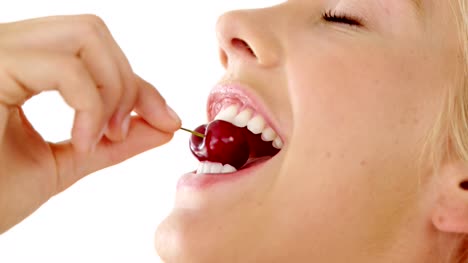 Clos-up-of-beautiful-woman-eating-cherry