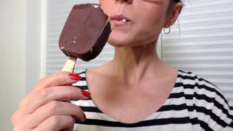 Woman-eat-ice-cream-close-up-to-camera