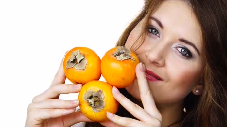 Woman-holds-persimmon-kaki-fruits,-isolated