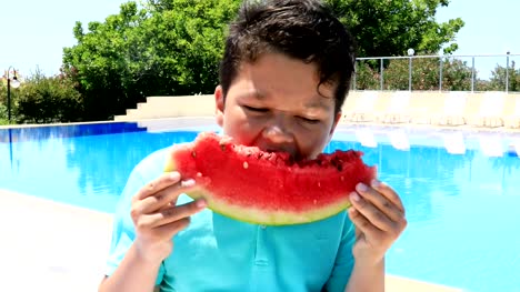 Young-boy-eating-watermelon