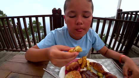 Child-eating-breakfast-at-the-outdoor