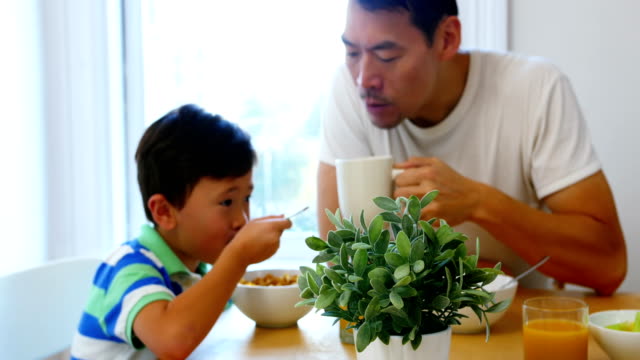 Father-and-son-having-breakfast