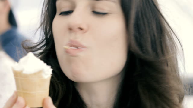 Beautiful-woman-eating-ice-cream-close-up