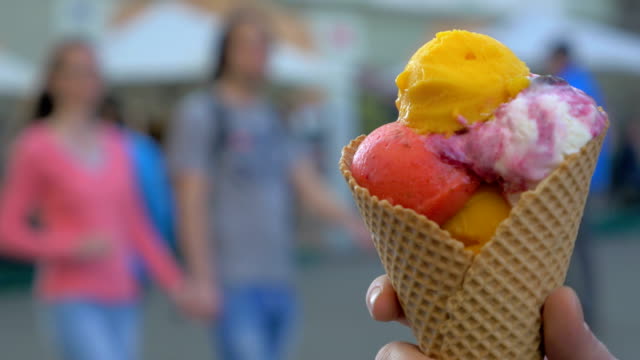 Waffle-cone-ice-cream-against-street-background