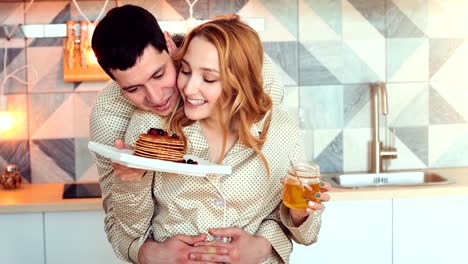 young-couple-in-morning-with-pancakes