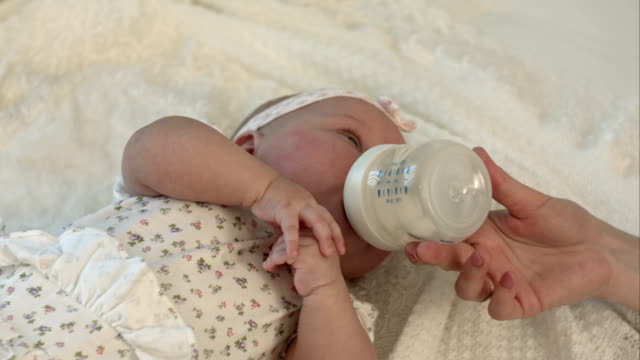 Little-baby-drinking-milk-from-bottle