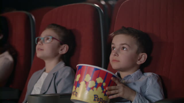 Children-watching-movies-in-cinema.-Movie-entertainment-for-kids