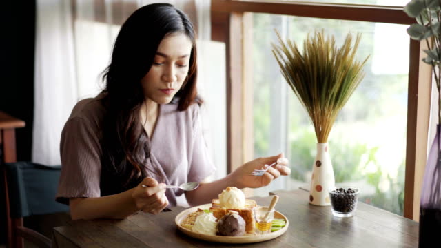 young-woman-eating-honey-toast