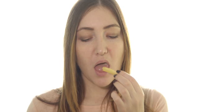 Young-woman-eating-fried-potatoes,-harmful-food.