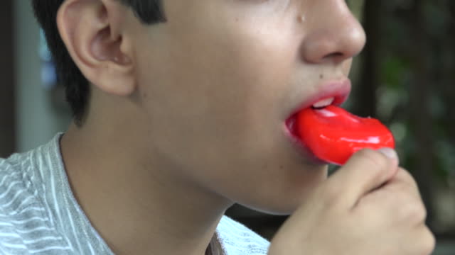 Boy-Eating-Red-Popsicle