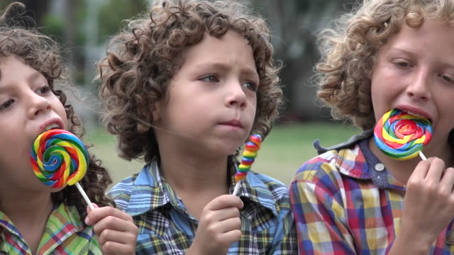 Brothers-Eating-Lollipop-Candy