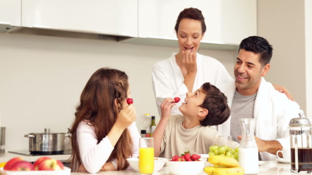 Happy-family-having-their-breakfast-together