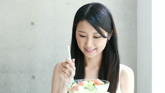 young-woman-eating-salad