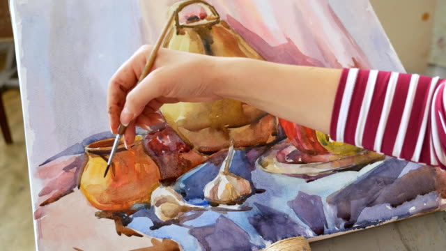 A-young-artist-in-an-art-workshop-draws-a-still-life-from-nature-in-watercolor