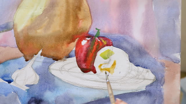 A-young-artist-in-an-art-workshop-draws-a-still-life-from-nature-in-watercolor