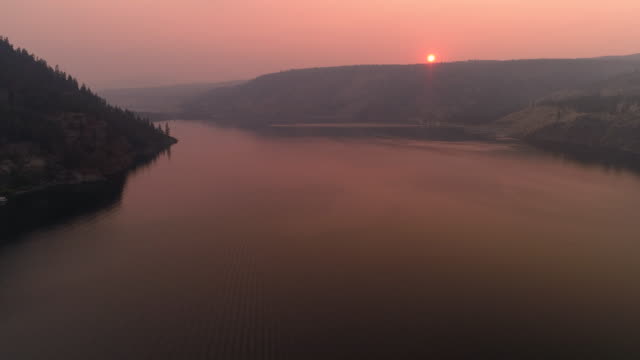Sunset-Aerial-Over-Lake-Roosevelt-in-Forest-Fire-Smoke-Haze