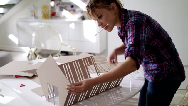 Woman-Working-As-Architect-Building-Housing-Model-Mock-up