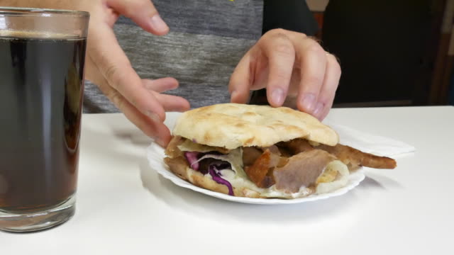 The-man-eats-kebabs-with-his-hands