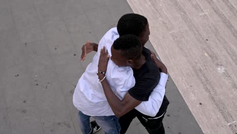 Young-black-african-men-greeting-and-hugging