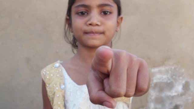 Indian-girl-pointing-straight-at-the-camera