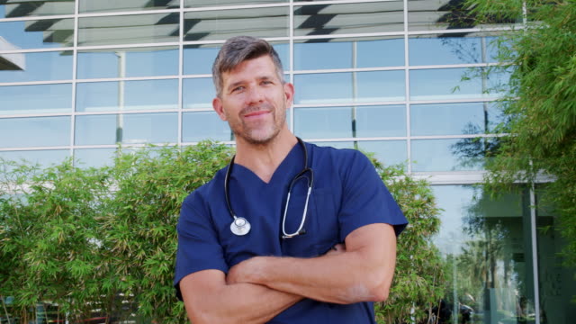 Caucasian-male-doctor-wearing-scrubs