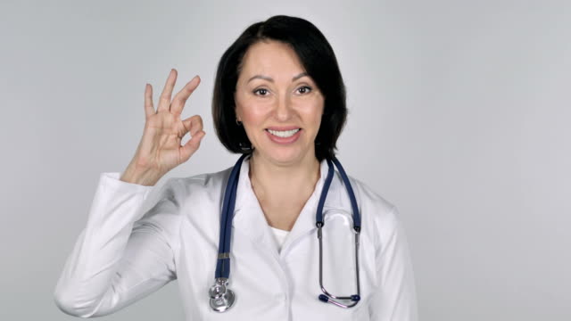 Portrait-of-Lady-Doctor-Gesturing--Okay-Sign