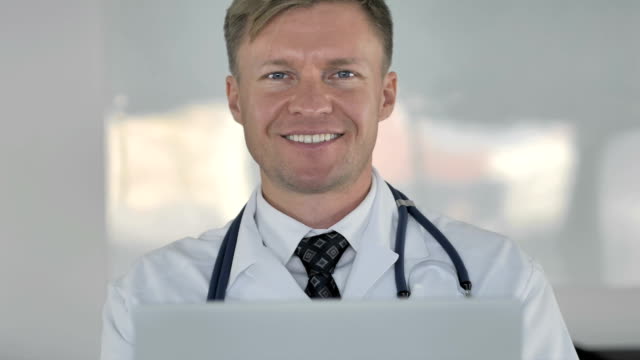 Smiling-Doctor-Looking-at-Camera-in-Clinic