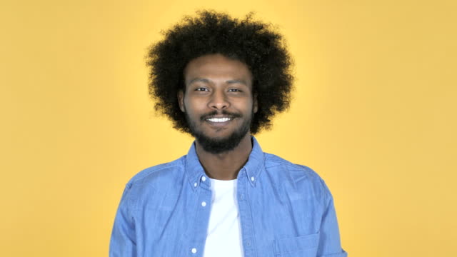 Smiling-Afro-American-Man-on-Yellow-Background