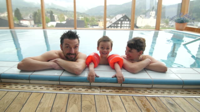Young-family-enjoying-at-hotel-with-spa