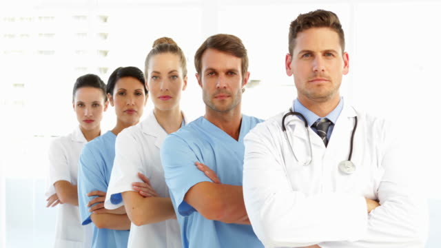 Frowning-medical-team-with-arms-crossed
