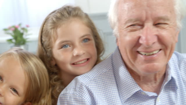 Portrait-Of-Children-With-Grandparents-At-Home,-Slow-Motion
