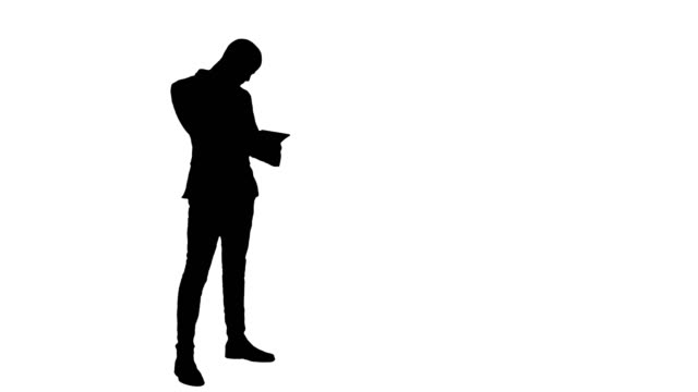 Silhouette-Busy-man-talking-on-the-phone-and-holding-tablet