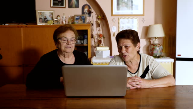 Two-older-women-talk-to-their-grandson-via-skype