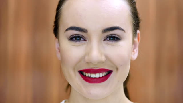 Close-Up-of-Smiling-Girl-Face,-Red-Lips