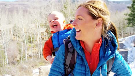 Portrait-Caucasian-mother-son-hiking-using-baby-carrier