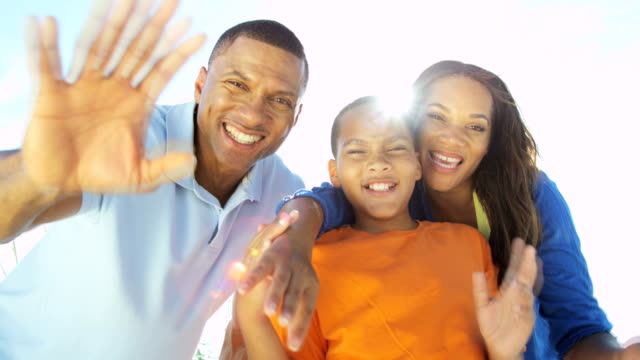 Portrait-of-African-American-family-making-video-diary