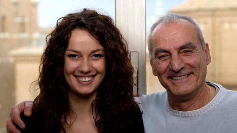 father-and-daughter-smile-at-the-camera