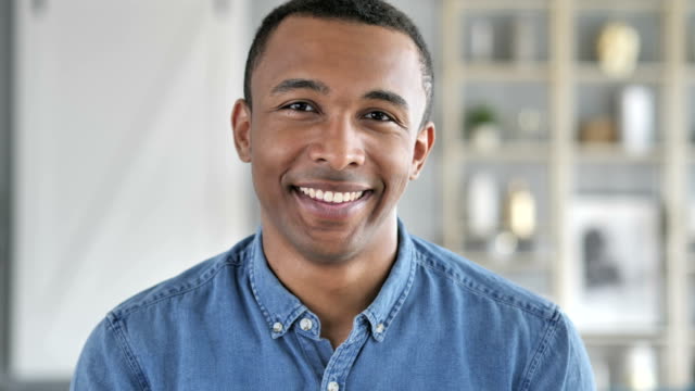 Portrait-of-Smiling-Young-African-Man-Looking-at-Camera