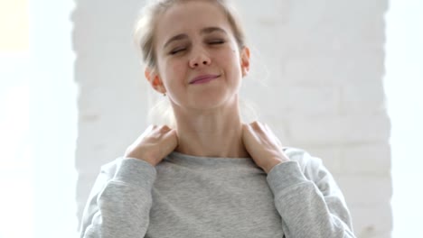 Tired-Young-Woman-Trying-to-Relax-Body-by-Stretching