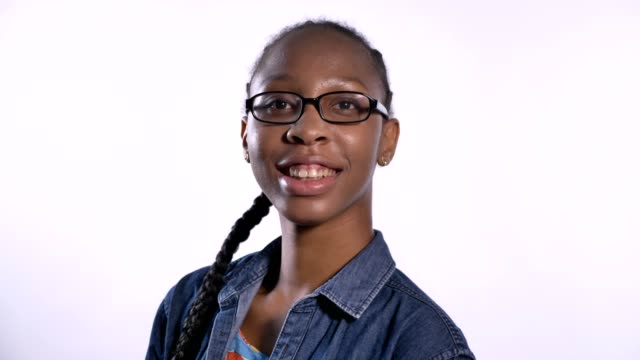 Young-charming-african-american-woman-in-glasses-smiling-at-camera,-isolated-over-white-background,-happy-and-cheerful