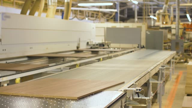 chipboards-on-conveyer-at-furniture-factory