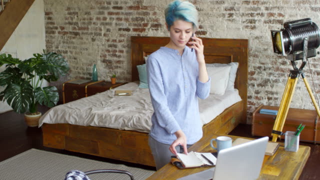 Female-Freelancer-Having-Phone-Call-with-Client