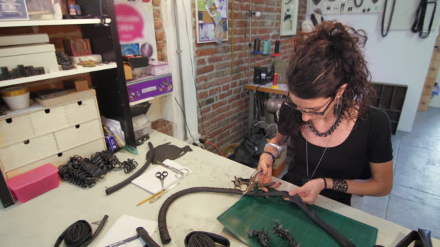 Young-eco-jewelry-maker-creating-artwork-in-her-atelier