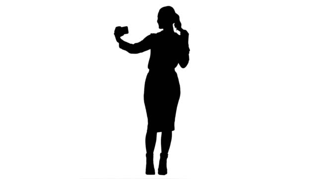 Silhouette-junge-hübsche-Geschäftsfrau-nehmen-Selfie-mit-Handy