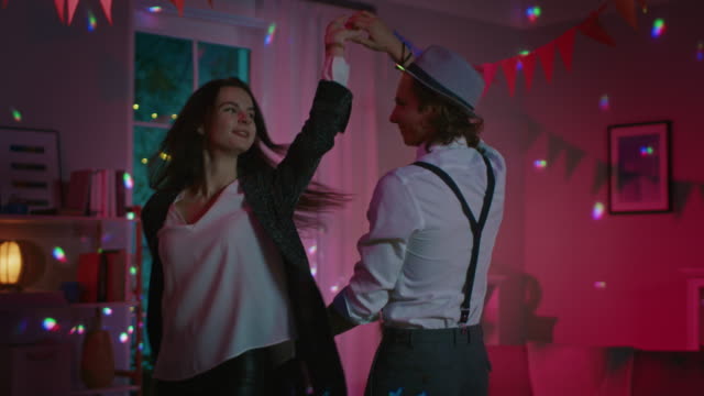 Romantic-Couple-at-Home:-Beautiful-Young-People,-Boy-and-Girl-Dancing-Slowly-in-the-Living-Room.-Stylish-Young-People-in-Love-Waltz.-Closeu-up-Slow-Motion-Shot.-Disco-Ball-Lighting.