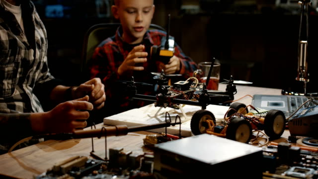Father-and-son-repairing-a-drone