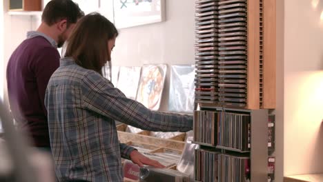 Two-people-browsing-through-records-at-a-record-shop