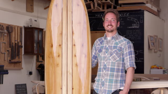 Portrait-Of-Carpenter-With-Surfboard-Shot-On-RED-Camera