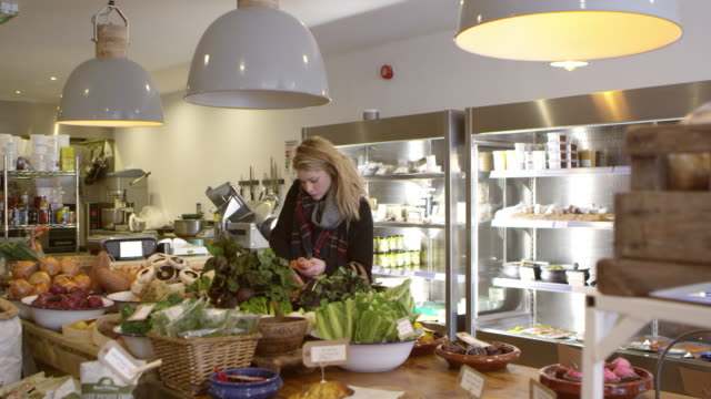 Woman-Shopping-For-Produce-In-Delicatessen-Shot-On-R3D