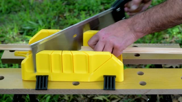 Cutting-mitered-cuts-using-saw-and-mitre-box